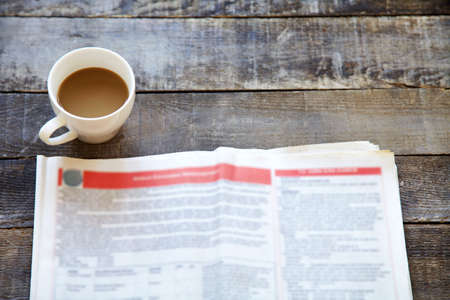 newspaper and coffee on  the tableの写真素材