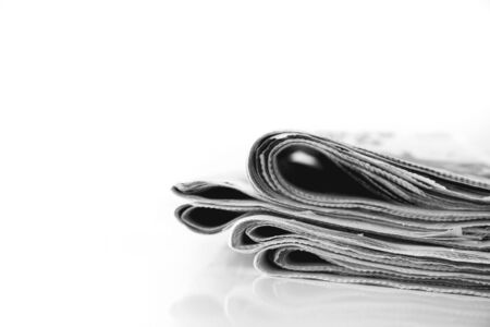 Reading newspaper on table