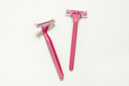Two pink razors isolated on white backgroundの写真素材