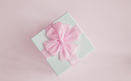 Gift box isolated on pink backgroundの写真素材