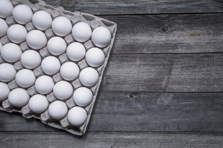 Organic egg pack isolated on wooden background