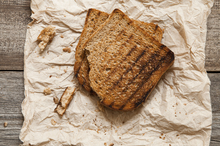 Slice breads on wooden backgroundの写真素材
