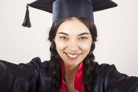 Portrait happy woman on her graduation day University. Education and people