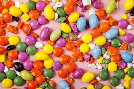 Colorful lollipops and different colored round candy. Top view.の写真素材