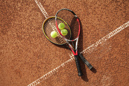 Tennis ball with racket on court