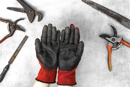 Top view retro working tools with hands on gray backgroundの写真素材