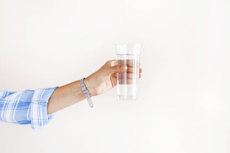 Woman hand holding drinking water