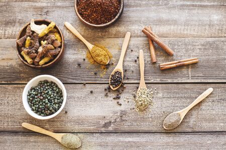 Variety of spices and herbs on kitchen tableの写真素材