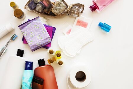 Toothbrush, wooden comb, white shampoo bottle and bath sponge on a white background. Flat lay. top view beauty items. Bathroom setの写真素材