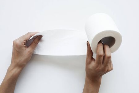 Rolls of toilet paper isolated on whiteの写真素材