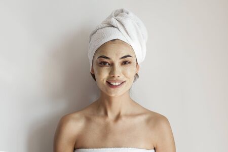 Smile, cream on her face, womanの写真素材