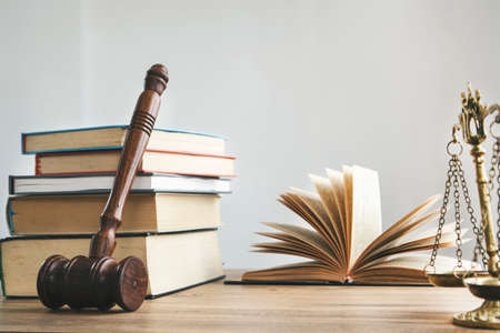 Justice legal and jurisprudence concept. Law books on lawyer desk at law firm.の写真素材