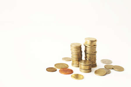Mixed coin stacks on a white background