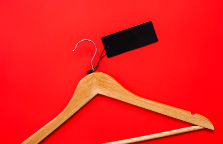 Coat hanger on red background.の写真素材