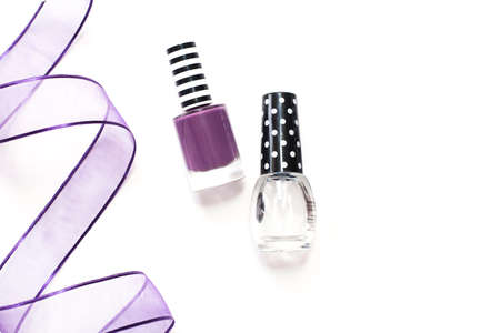 Nail polish bottles on white background