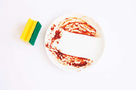 High angle view of dirty white plate on white backgroundの写真素材
