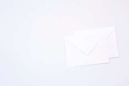 Blank envelope isolated background arranged for mockup designの写真素材