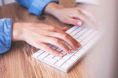 Hands of an office woman typingの写真素材