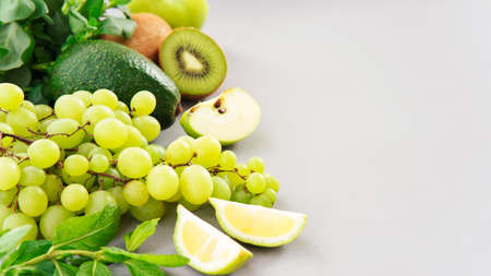 Healthy vegetarian food concept background, fresh green food selection for detox dietの写真素材