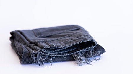 jeans on the background, blue and black jeans lie on a white background,の写真素材