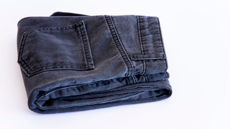 jeans on the background, blue and black jeans lie on a white background,の写真素材