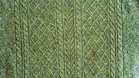 Knitted seamless background with copyspace. Blue and green sweater pattern for Christmas or winter design.の写真素材