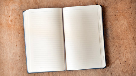 Notebook on a wooden background, spiral notepad on a table
