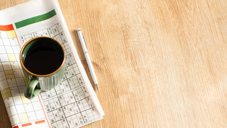 crossword paper with pen and coffee cupの写真素材