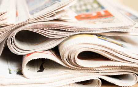 Different newspapers against newspaper background
