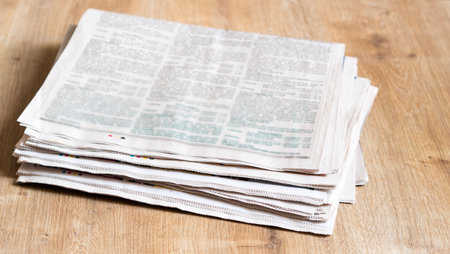 Different newspapers against newspaper backgroundの写真素材