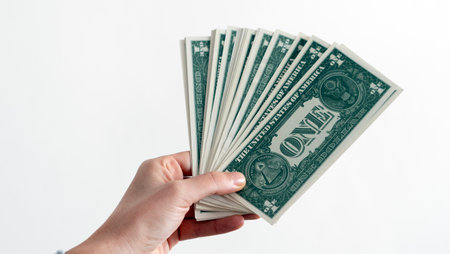 A woman hand offering dollar, euro notes and holding bunch of euro money. Euro, dollar banknotes, European Union paper currency. Saving money concept.の写真素材