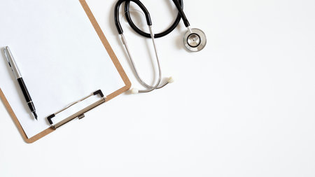 Top view of doctor office work with stethoscope, laptop and clipbroad with copy space for your text.の写真素材