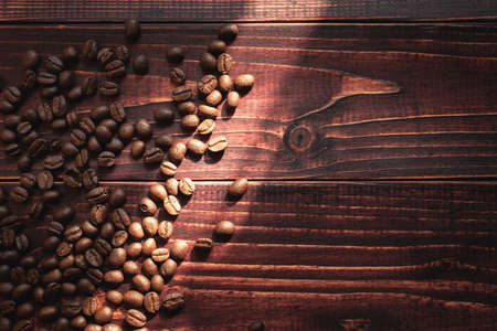 Arabica coffee beans  on the wooden background.Popular natural food productsの写真素材