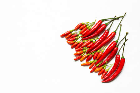 Group of  red peppers   on white wooden background,closeup,has copy spaceの写真素材