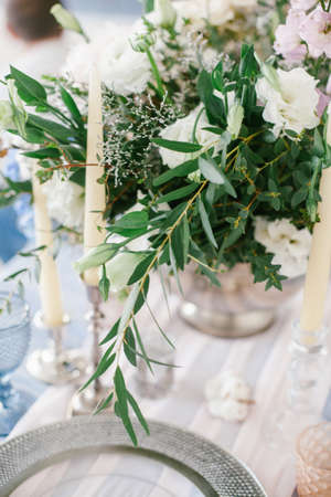 Silver candlestick as element of festive table wedding centerpieces decorations.の写真素材