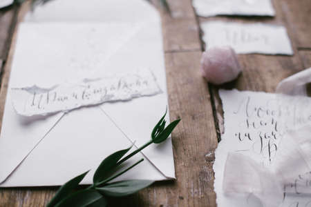 Graphic arts of beautiful wedding calligraphy cards with flower and mineral stone on wood background.の写真素材