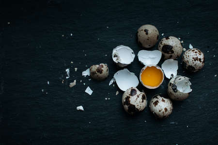 Fresh Quail eggs on dark moody background.の写真素材