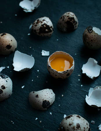 Fresh Quail eggs on dark moody background.の写真素材