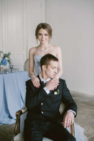 The newly-married couple holding hands. Bridal fashion.の写真素材