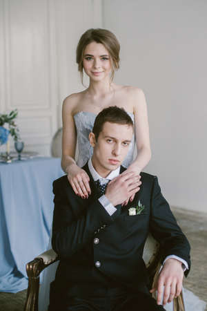 The newly-married couple holding hands. Bridal fashion.の写真素材