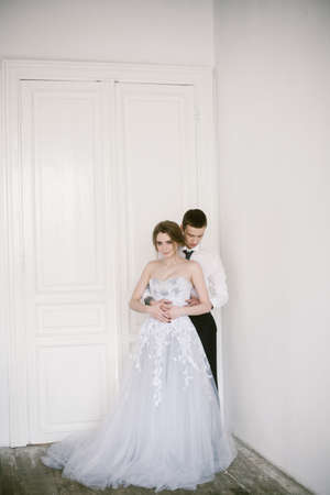 The newly-married couple holding hands. Bridal fashion.の写真素材