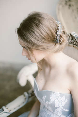Fashion bridal hairstyle with jewellery floral decoration in hair.の写真素材