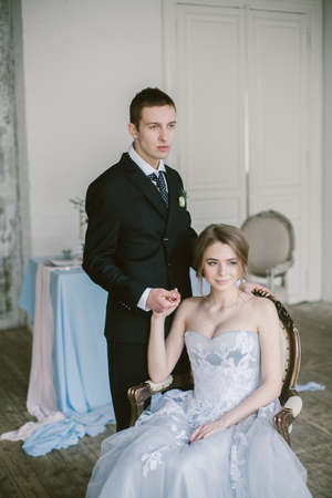 The newly-married couple holding hands. Bridal fashion.の写真素材