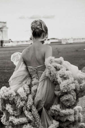 Bridal Fashion. Portrait of young running out bride with stylish hairdo in pink wedding dress.の写真素材