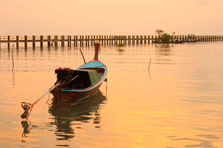 Boat in the golden seaの写真素材