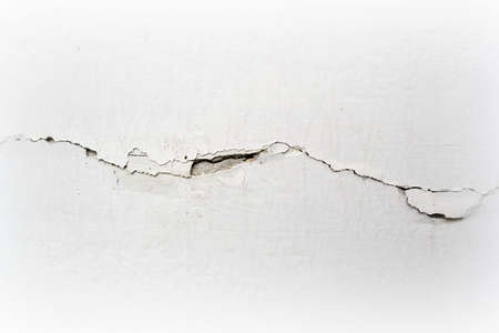 Cracks On The White Wall Of Building.の写真素材