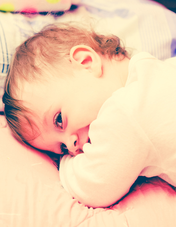 Happy toddler girl smiling, looking very cuteの写真素材