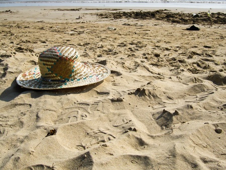 an old hat on the beachの写真素材