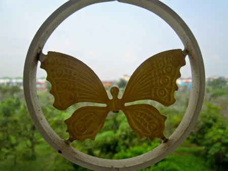 Metal Butterfly found on windowの写真素材
