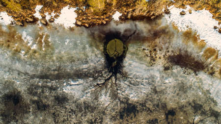 Drone view on river with melting ice, sunny spring weather.の写真素材